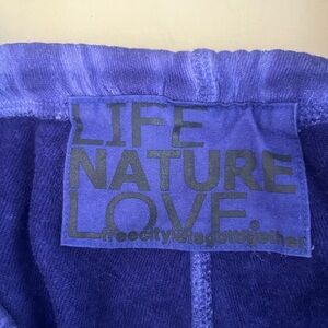 FreeCity ¾ sweatpants.  Bright blue color.  Size 0/XS